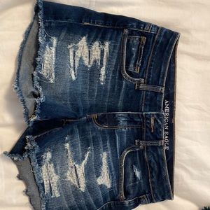 American Eagle stretchy, Distressed jean shorts. Dark wash & medium distressing